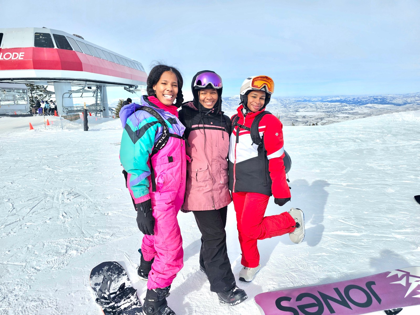 Sojourn Wallace and two friends laughing at the top of the lift